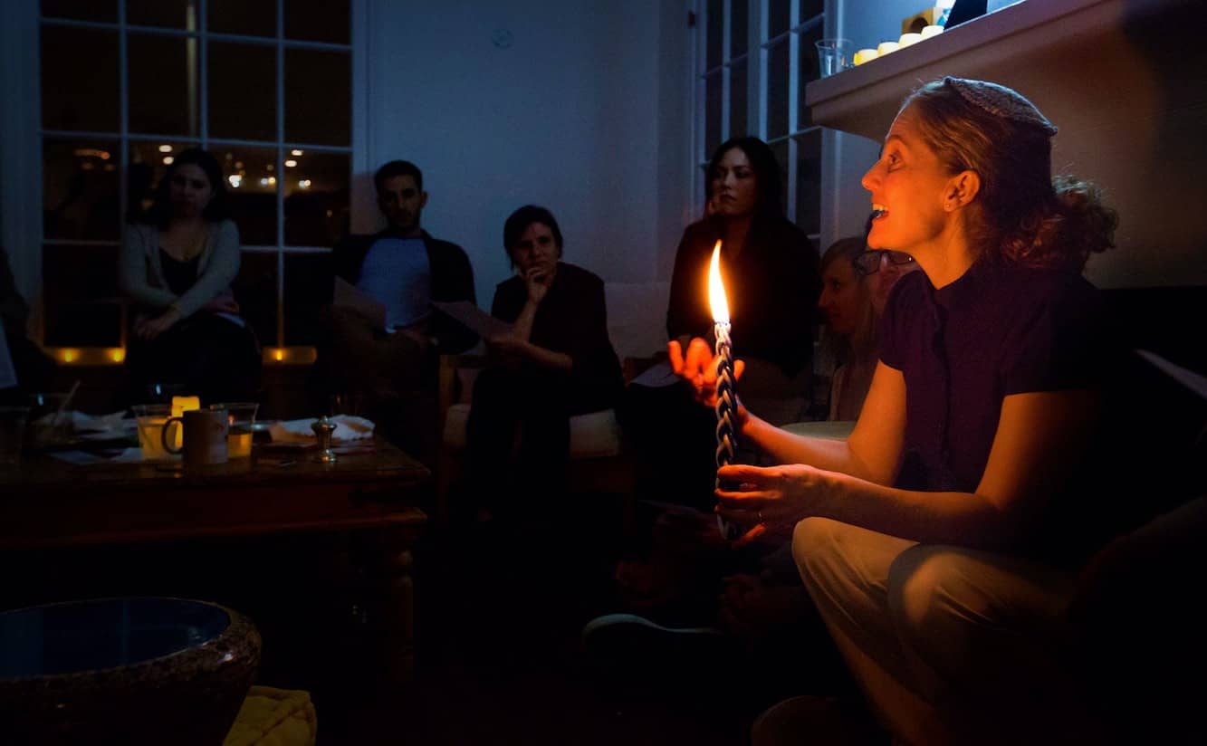 Rabbi Susan Goldberg with candle.